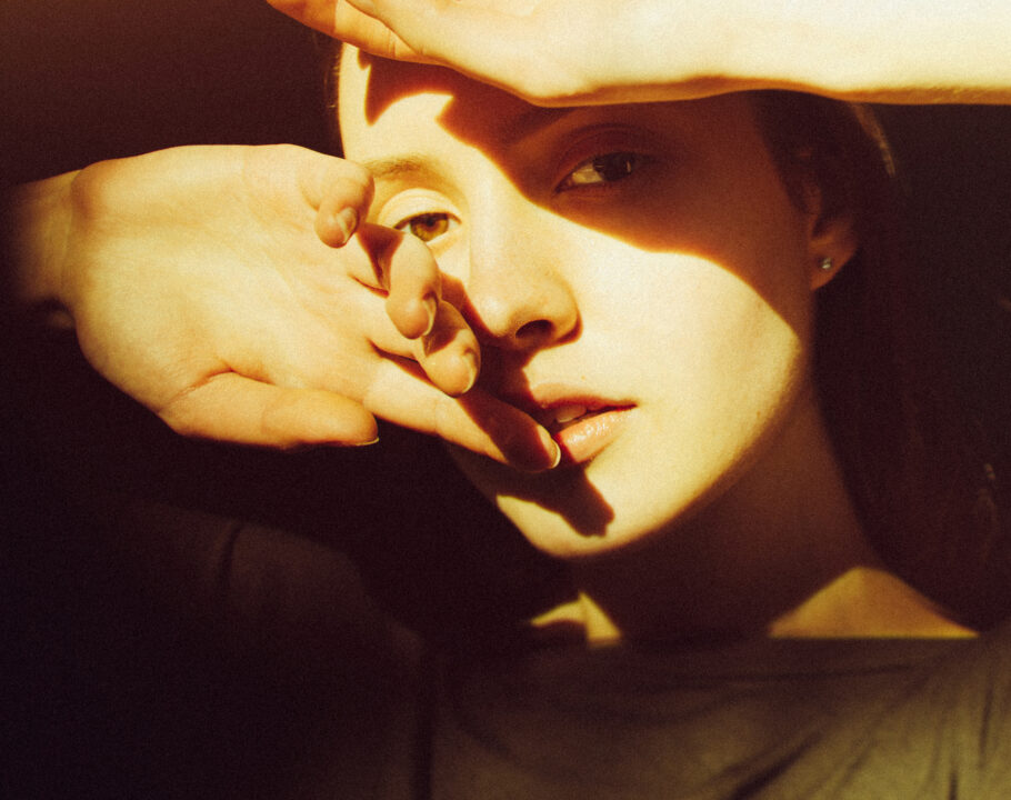 Close-up of young woman in sunlight
